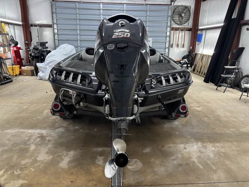 Slide: The Image of 2013 Ranger 520C boat with Evinrude 250 motor in garage. - 9