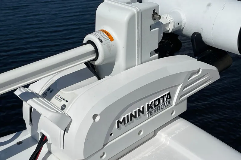 Slide: The Image of Minn Kota Terrova motor on 2024 Sportsman Masters 247 Bay Boat, over water. - 19