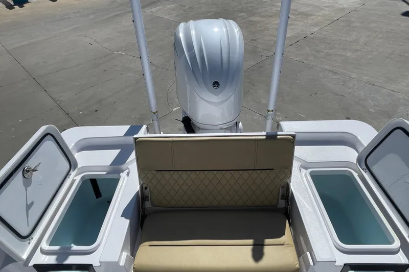 Slide: The Image of 2024 Sportsman Masters 247 Bay Boat with seating and storage compartments. - 23