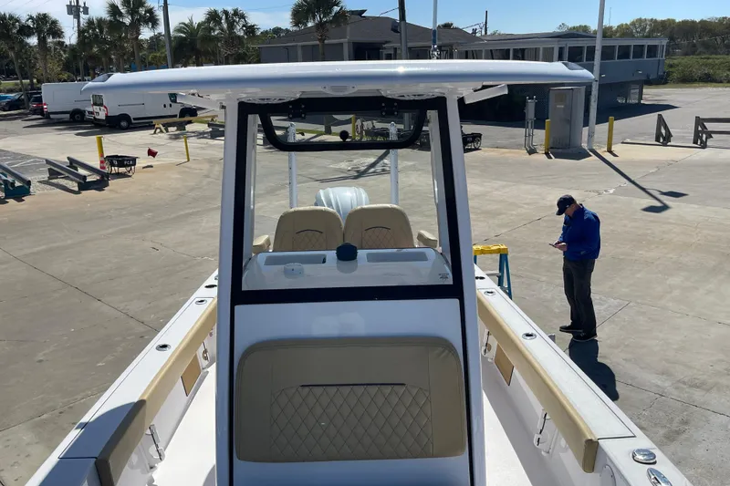 Slide: The Image of 2024 Sportsman Masters 247 Bay Boat on a parking lot. - 25