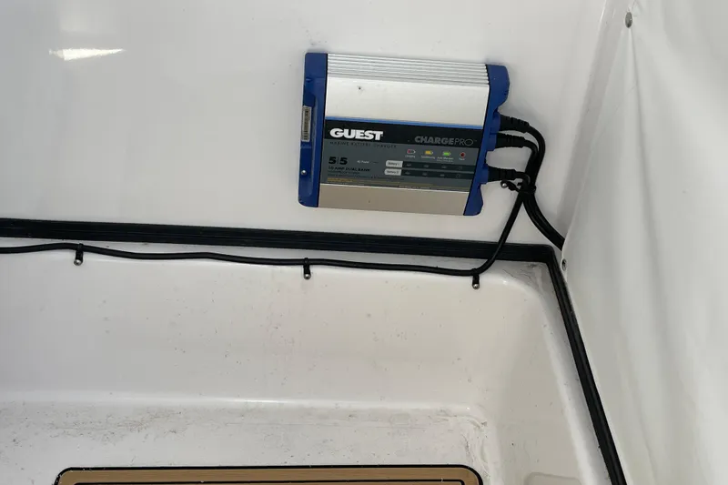 Slide: The Image of Battery charger installed on 2024 Sportsman Masters 247 Bay Boat interior. - 29