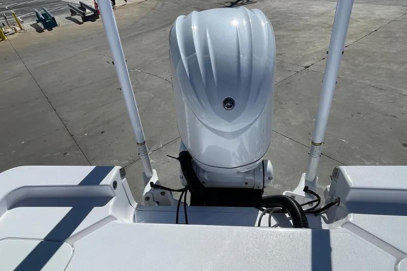 Slide: The Image of 2024 Sportsman Masters 247 Bay Boat engine view on concrete surface. - 30