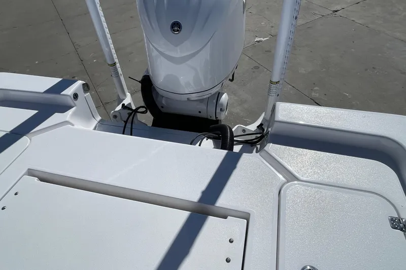 Slide: The Image of 2024 Sportsman Masters 247 Bay Boat stern view with motor and deck details. - 31