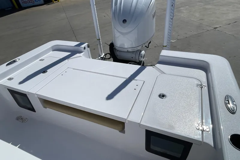 Slide: The Image of 2024 Sportsman Masters 247 Bay Boat with sleek deck and powerful outboard motor. - 32