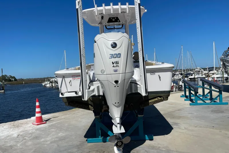 Slide: The Image of 2024 Sportsman Masters 247 Bay Boat with Yamaha 300 V6 engine at marina. - 33