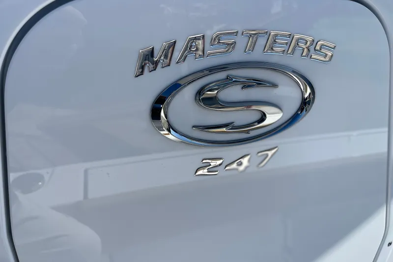 Slide: The Image of 2024 Sportsman Masters 247 Bay Boat emblem on a sleek white surface. - 4