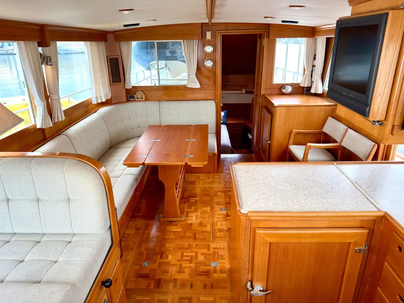 Slide: The Image of Interior of a 2003 Grand Banks Classic yacht with wooden furnishings. - 12