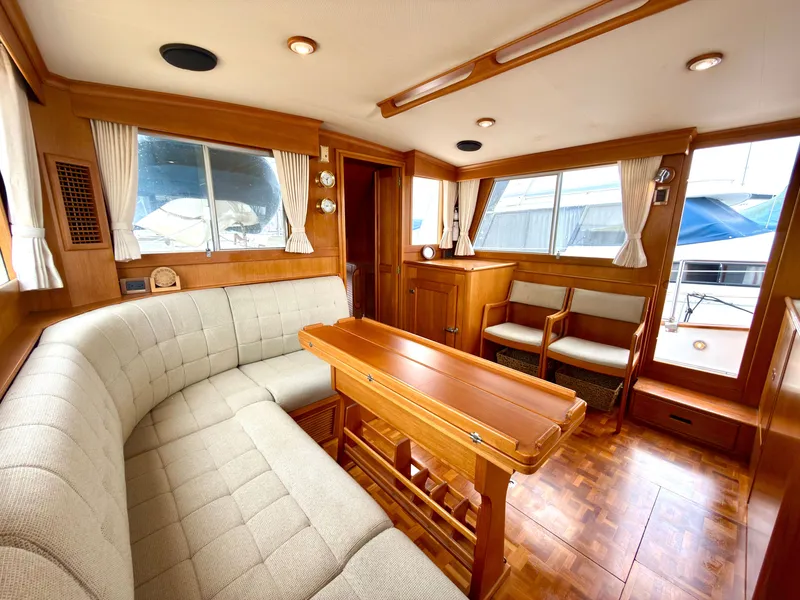 Slide: The Image of Interior of a 2003 Grand Banks Classic yacht with wooden furnishings. - 13