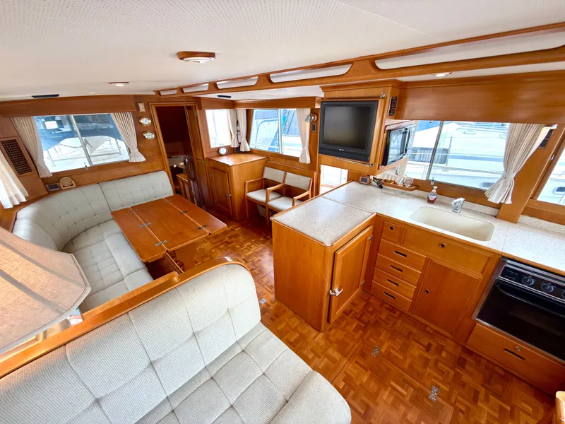 Slide: The Image of Interior of a 2003 Grand Banks Classic yacht with wooden furnishings. - 14