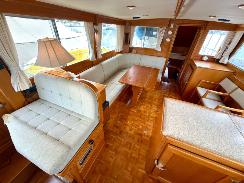 Slide: The Image of Interior of a 2003 Grand Banks Classic yacht with wooden furnishings. - 16