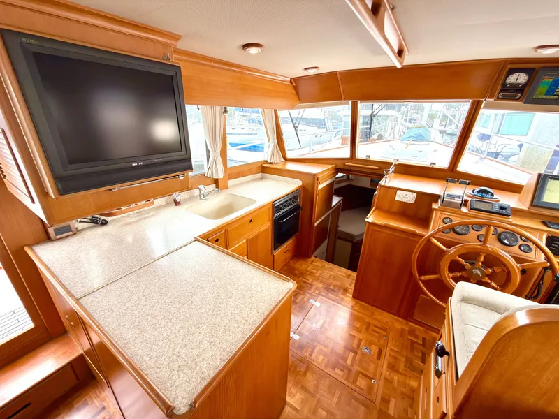 Slide: The Image of Interior of a 2003 Grand Banks Classic yacht with wooden finish. - 19
