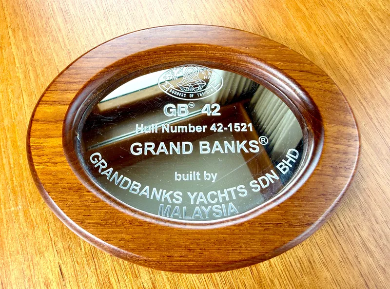 Slide: The Image of Grand Banks Classic 2003 plaque with hull number and manufacturer details. - 22