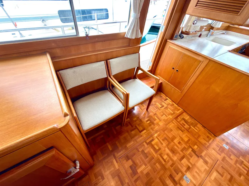 Slide: The Image of Interior of a 2003 Grand Banks Classic yacht with wooden furniture. - 23