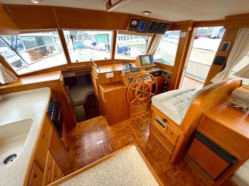Slide: The Image of Interior of a 2003 Grand Banks Classic yacht with wooden finish. - 25