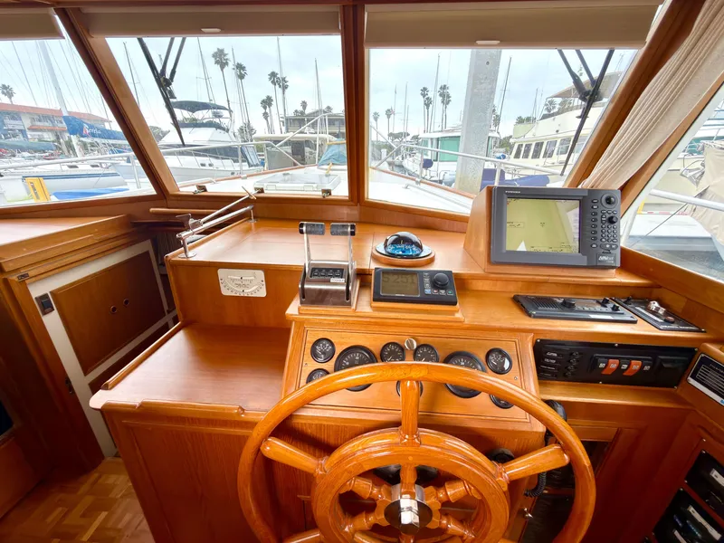 Slide: The Image of Helm of a 2003 Grand Banks Classic yacht in harbor. - 28