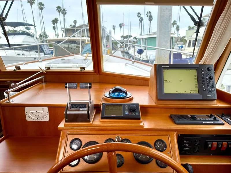 Slide: The Image of Helm of a 2003 Grand Banks Classic yacht in harbor. - 29