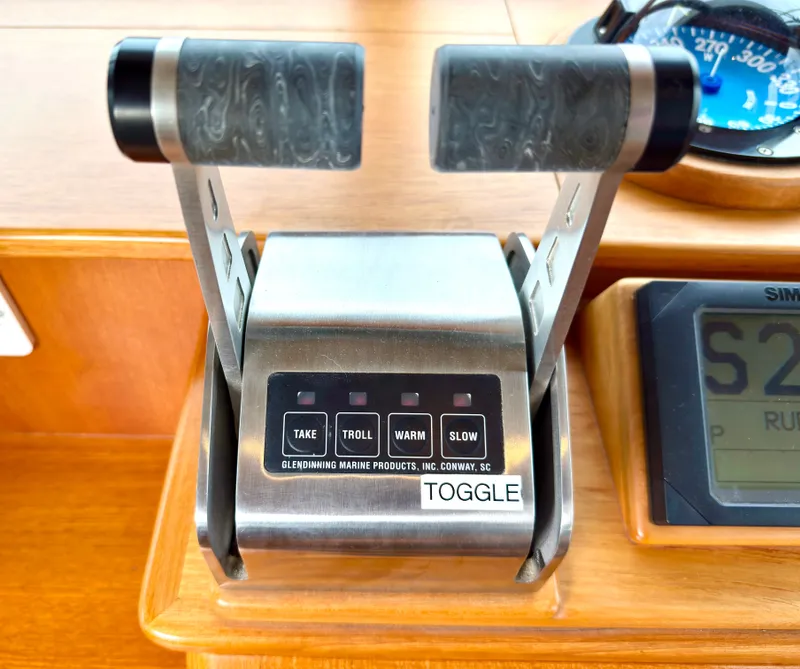 Slide: The Image of Throttle controls of a 2003 Grand Banks Classic boat. - 31