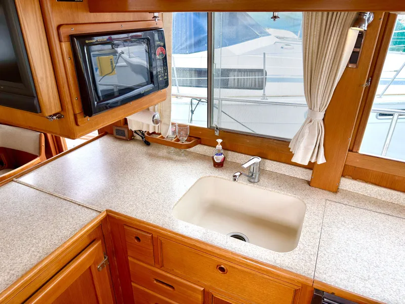 Slide: The Image of Interior of a 2003 Grand Banks Classic yacht kitchen area. - 44