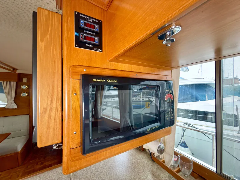 Slide: The Image of Interior of a 2003 Grand Banks Classic yacht with microwave. - 45