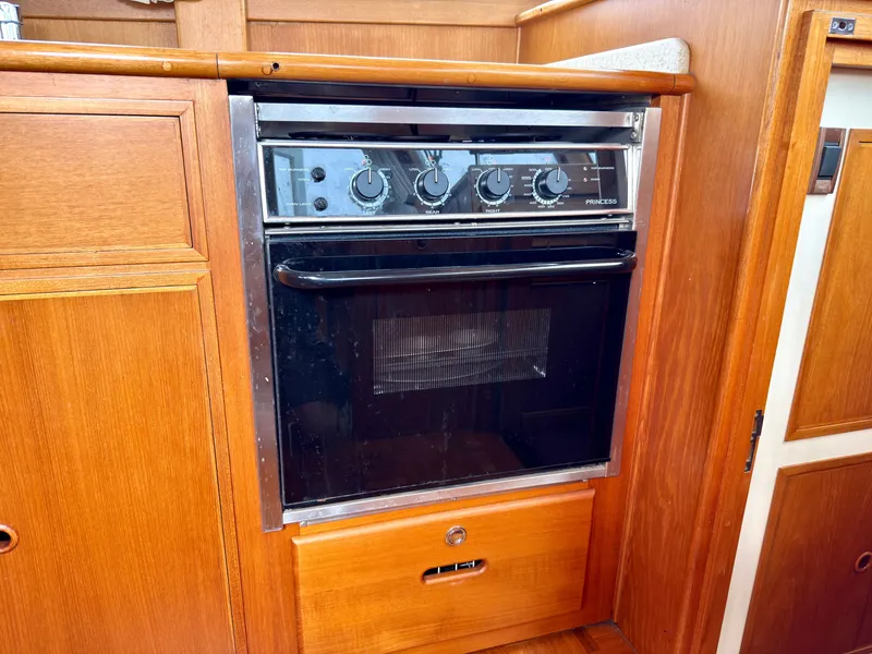 Slide: The Image of Kitchen oven in a 2003 Grand Banks Classic yacht. - 48
