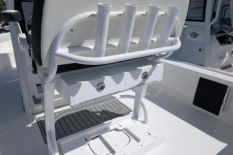 Slide: The Image of Tidewater 2410 Bay Max 2026 boat interior with rod holders and storage compartments. - 12