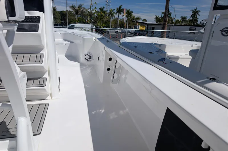 Slide: The Image of 2026 Tidewater 2410 Bay Max boat interior with seating and control panel. - 13