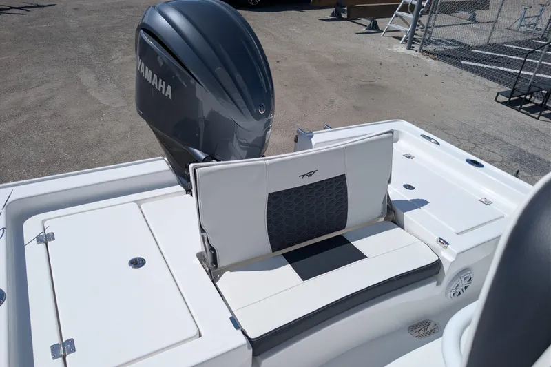 Slide: The Image of 2026 Tidewater 2410 Bay Max boat with Yamaha engine, featuring sleek seating and storage compartments. - 14