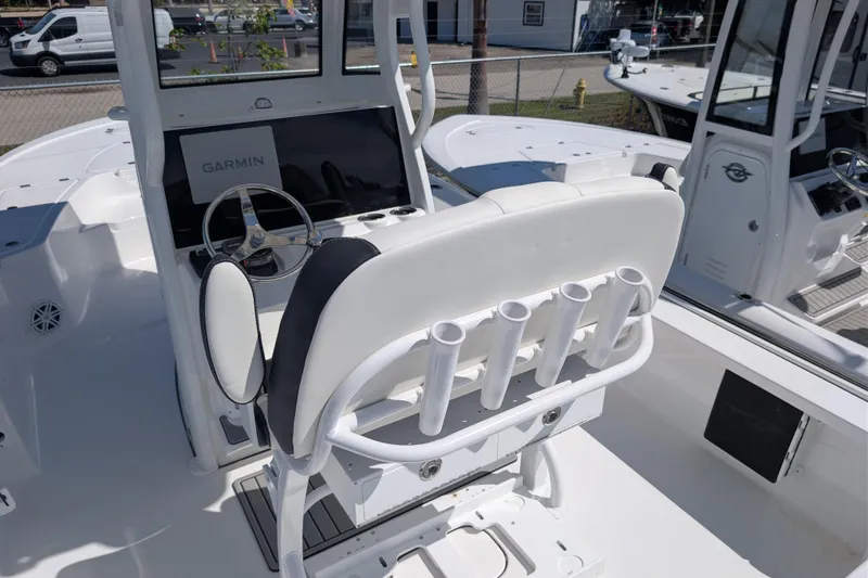 Slide: The Image of 2026 Tidewater 2410 Bay Max boat interior with Garmin display and rod holders. - 8