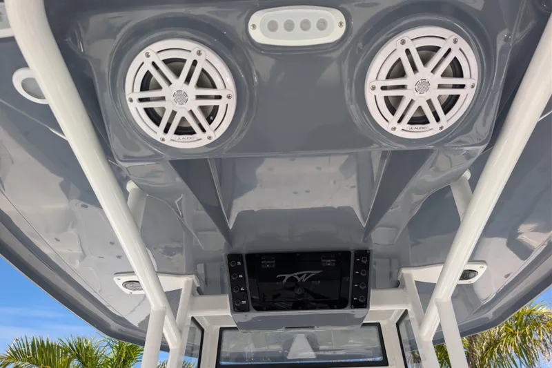 Slide: The Image of 2026 Tidewater 2110 Bay Max boat interior with speakers and control panel. - 8