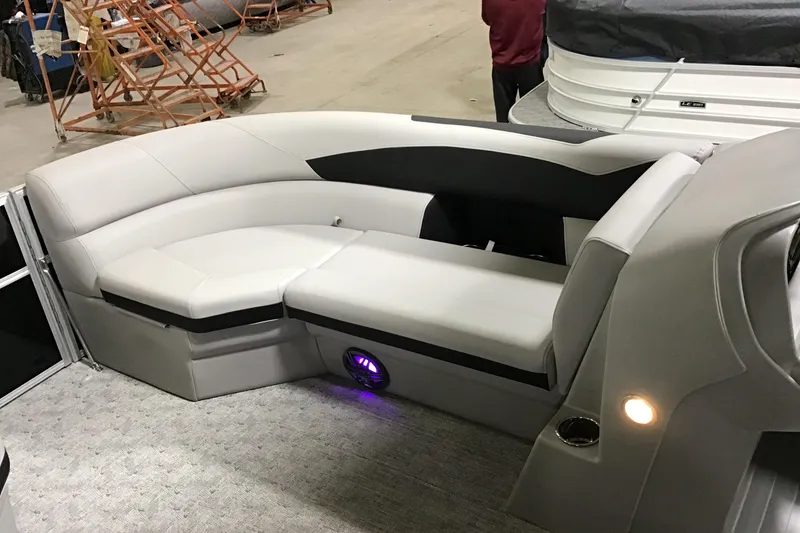 Slide: The Image of Luxurious seating on 2026 Berkshire 24RFX LE pontoon boat with ambient lighting. - 4