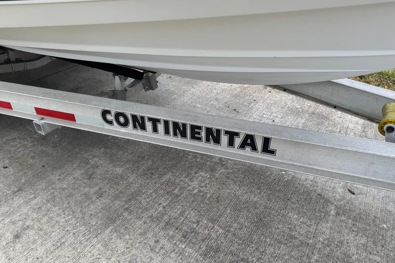 Slide: The Image of Trailer for 2012 NauticStar 2500XS Offshore boat, labeled "Continental." - 8