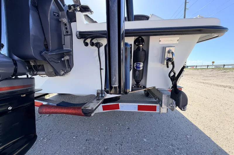 Slide: The Image of Rear view of a 2021 Maverick 18 HPX-V boat on a trailer, showcasing motor and components. - 11