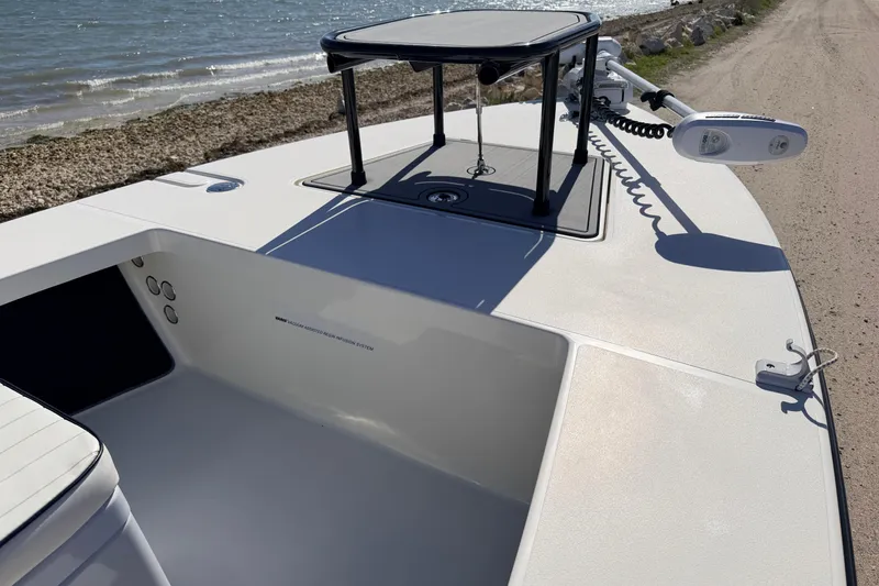 Slide: The Image of 2021 Maverick 18 HPX-V boat deck near shoreline, featuring modern design and equipment. - 14