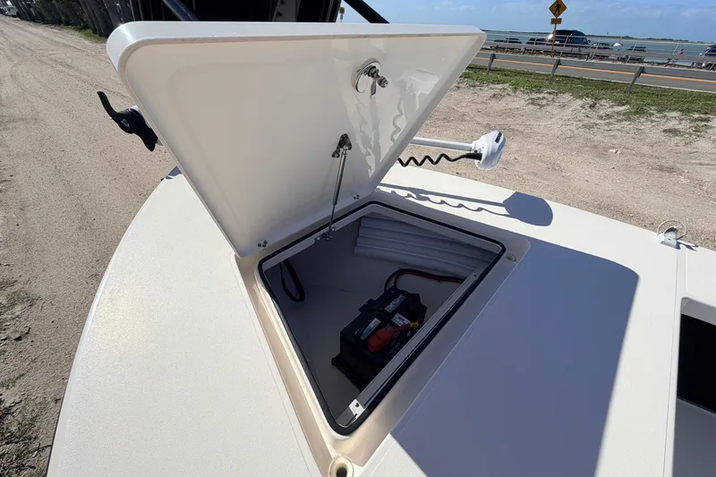 Slide: The Image of Open hatch on 2021 Maverick 18 HPX-V boat showing battery compartment. - 20