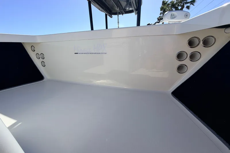 Slide: The Image of 2021 Maverick 18 HPX-V boat interior with sleek design and multiple rod holders. - 23