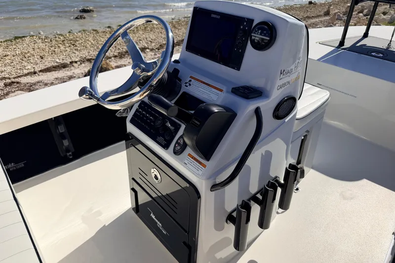 Slide: The Image of 2021 Maverick 18 HPX-V boat console with steering wheel and navigation controls. - 27