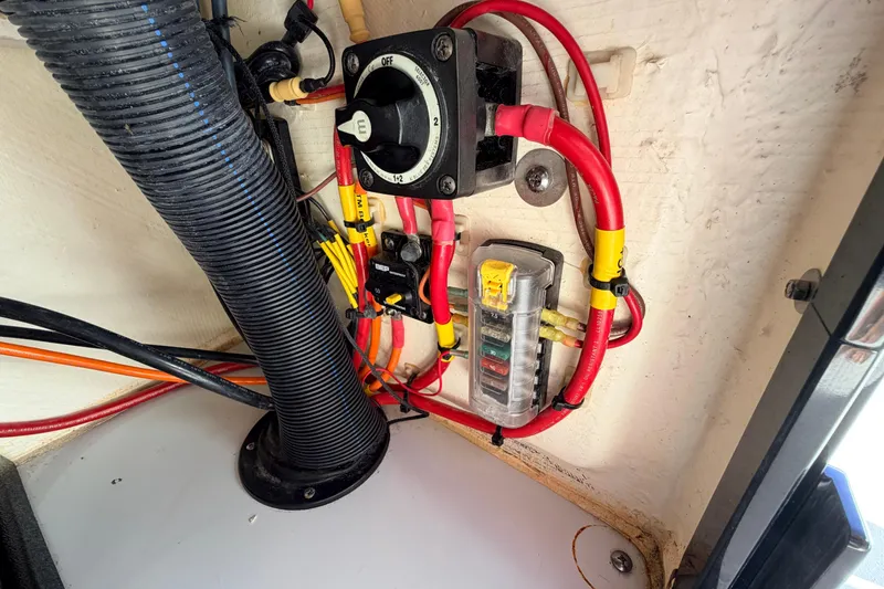 Slide: The Image of Electrical wiring and components inside a 2021 Maverick 18 HPX-V boat. - 37