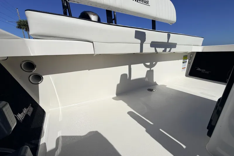 Slide: The Image of 2021 Maverick 18 HPX-V boat interior with white seating and storage compartments. - 39