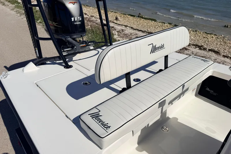 Slide: The Image of 2021 Maverick 18 HPX-V boat with Yamaha 115 engine, docked by the shore. - 40