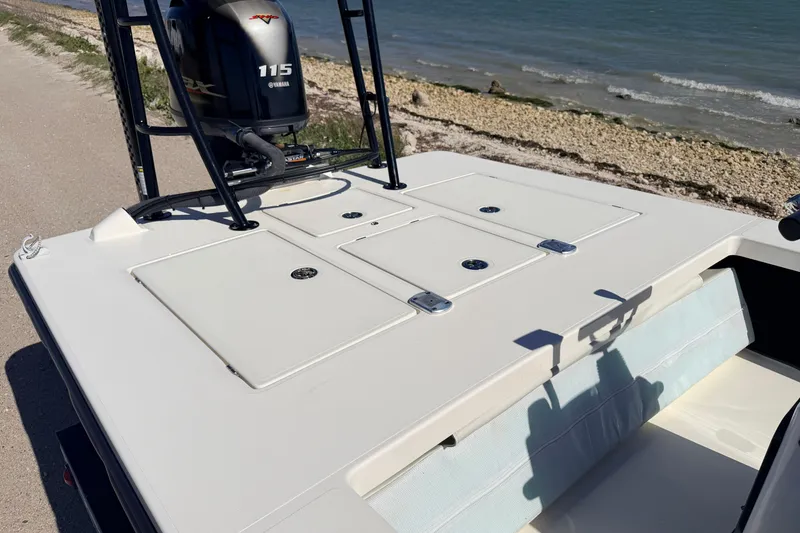 Slide: The Image of 2021 Maverick 18 HPX-V boat with Yamaha 115 engine by the shoreline. - 41