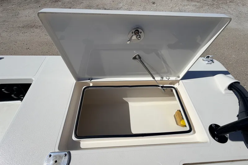 Slide: The Image of Open storage compartment on 2021 Maverick 18 HPX-V boat, showcasing interior space. - 43