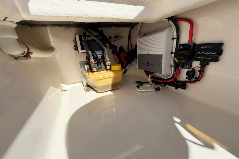 Slide: The Image of 2021 Maverick 18 HPX-V boat wiring and components in storage compartment. - 44