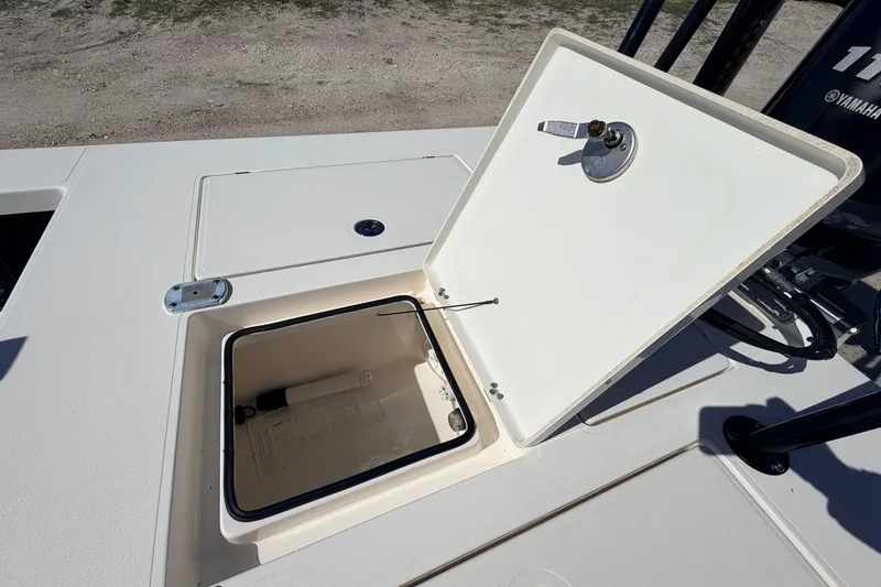 Slide: The Image of 2021 Maverick 18 HPX-V boat storage compartment open, showcasing interior details. - 46