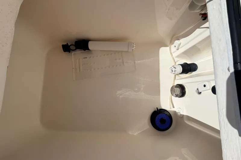 Slide: The Image of 2021 Maverick 18 HPX-V boat compartment with various fittings and components. - 47