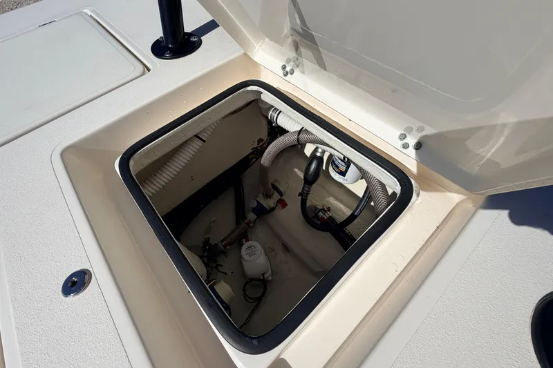 Slide: The Image of Open hatch of 2021 Maverick 18 HPX-V boat showing internal components and wiring. - 52