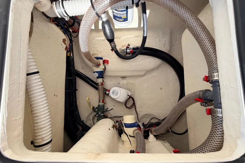 Slide: The Image of 2021 Maverick 18 HPX-V boat bilge area with hoses and wiring. - 53