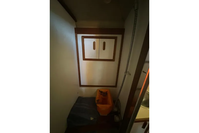 Slide: The Image of Interior of 1985 Carver 3207 Aft Cabin Motor Yacht with storage cabinet. - 18