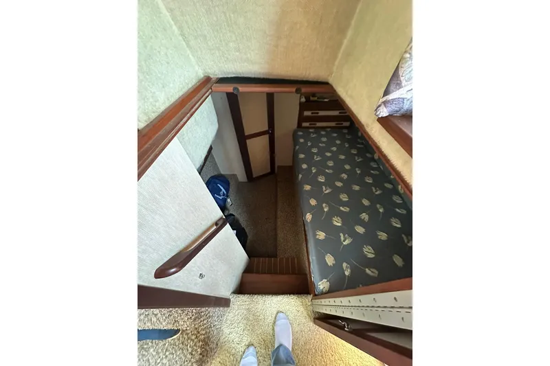 Slide: The Image of Interior cabin view of 1985 Carver 3207 Aft Cabin Motor Yacht with patterned bedding. - 20