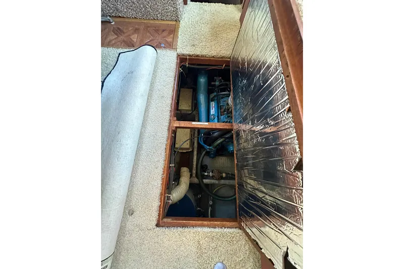 Slide: The Image of Engine compartment of 1985 Carver 3207 Aft Cabin Motor Yacht with exposed machinery. - 26