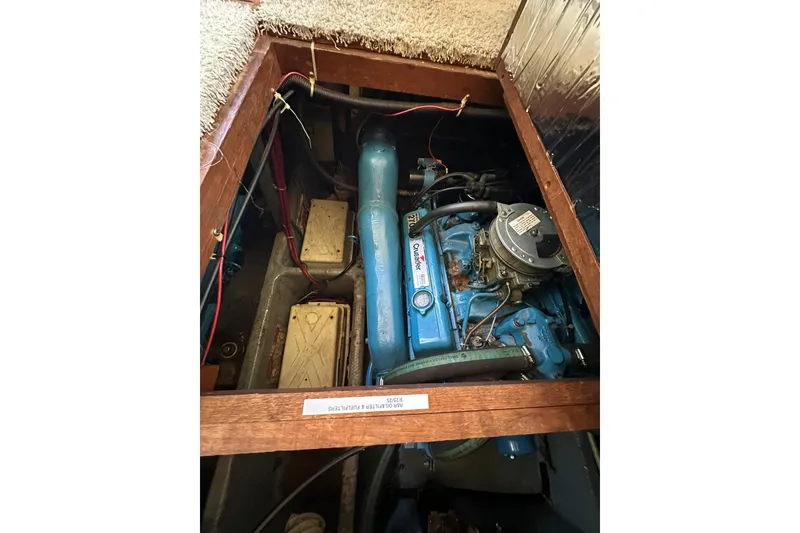 Slide: The Image of Engine compartment of a 1985 Carver 3207 Aft Cabin Motor Yacht, featuring a Crusader engine. - 27